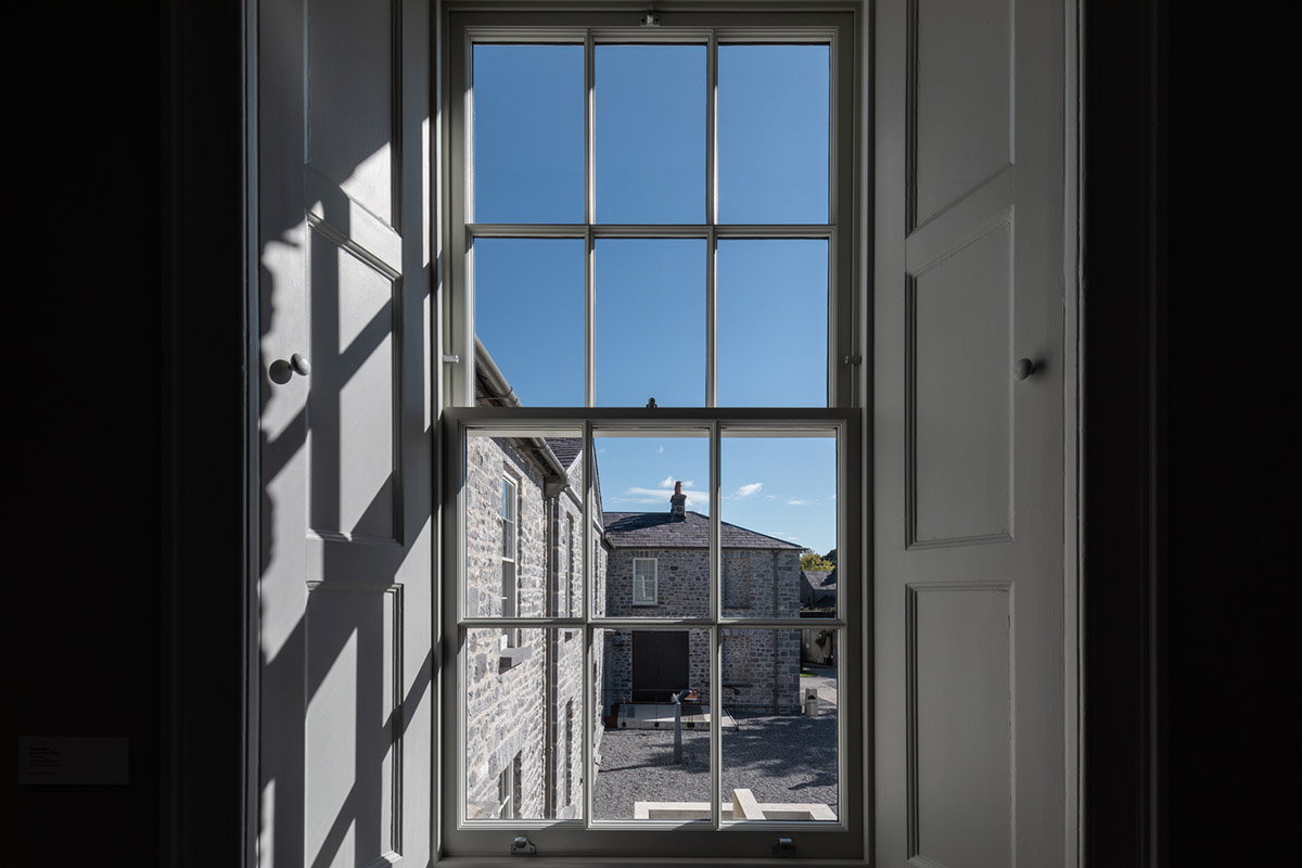 Mccullough Mulvin Architects adds two metal-clad volumes to convert former almshouse into art gallery