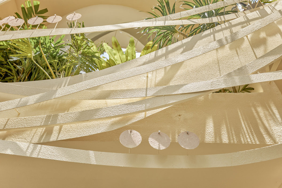 September Cafe is designed to look like a bird's nest with curved steel stripes in Vietnam