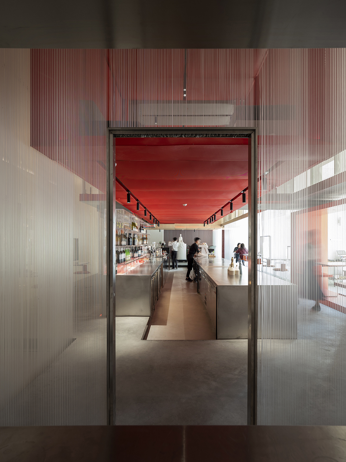 Waterfrom Design completes Doko Bar with giant bloody red boxes in Shenzhen