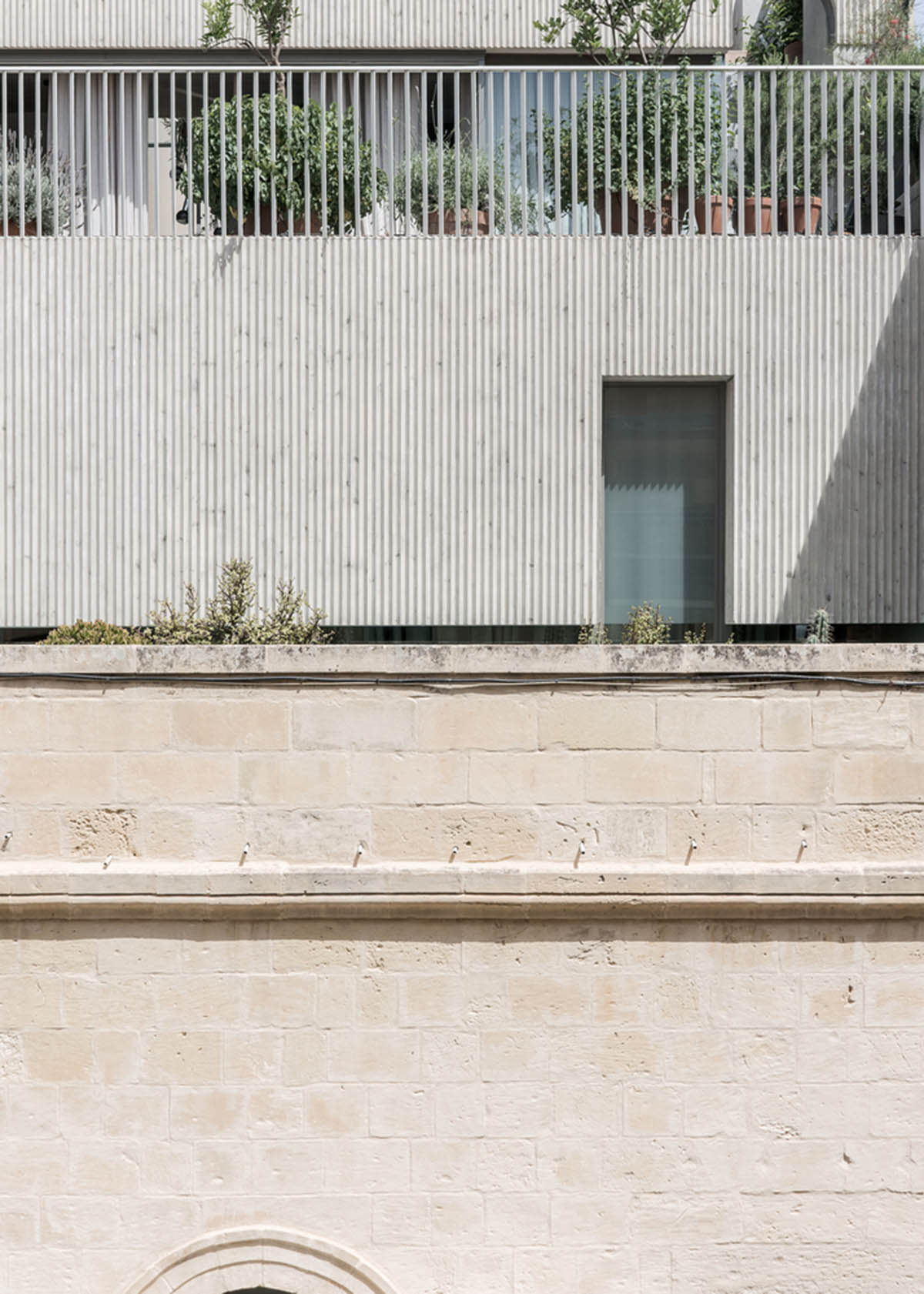 Chris Briffa converts old building into his home office by combining soft and hard materials in Malta