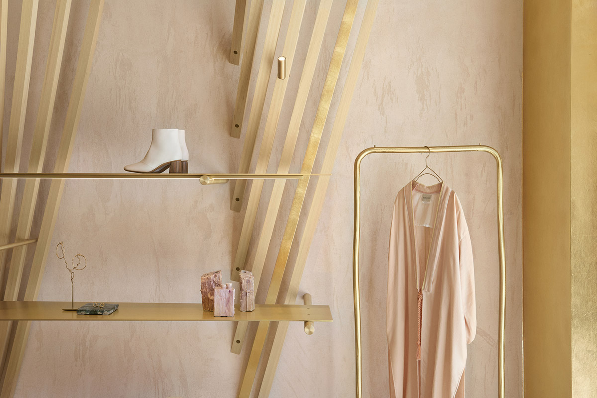 Golden and powder-colored details dominate forte_forte forte dei Marmi boutique in Italy