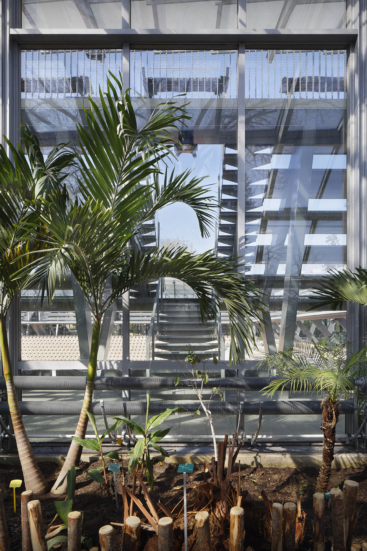 Marc Mimram built greenhouses in all sides of a tennis stadium to attract different audiences