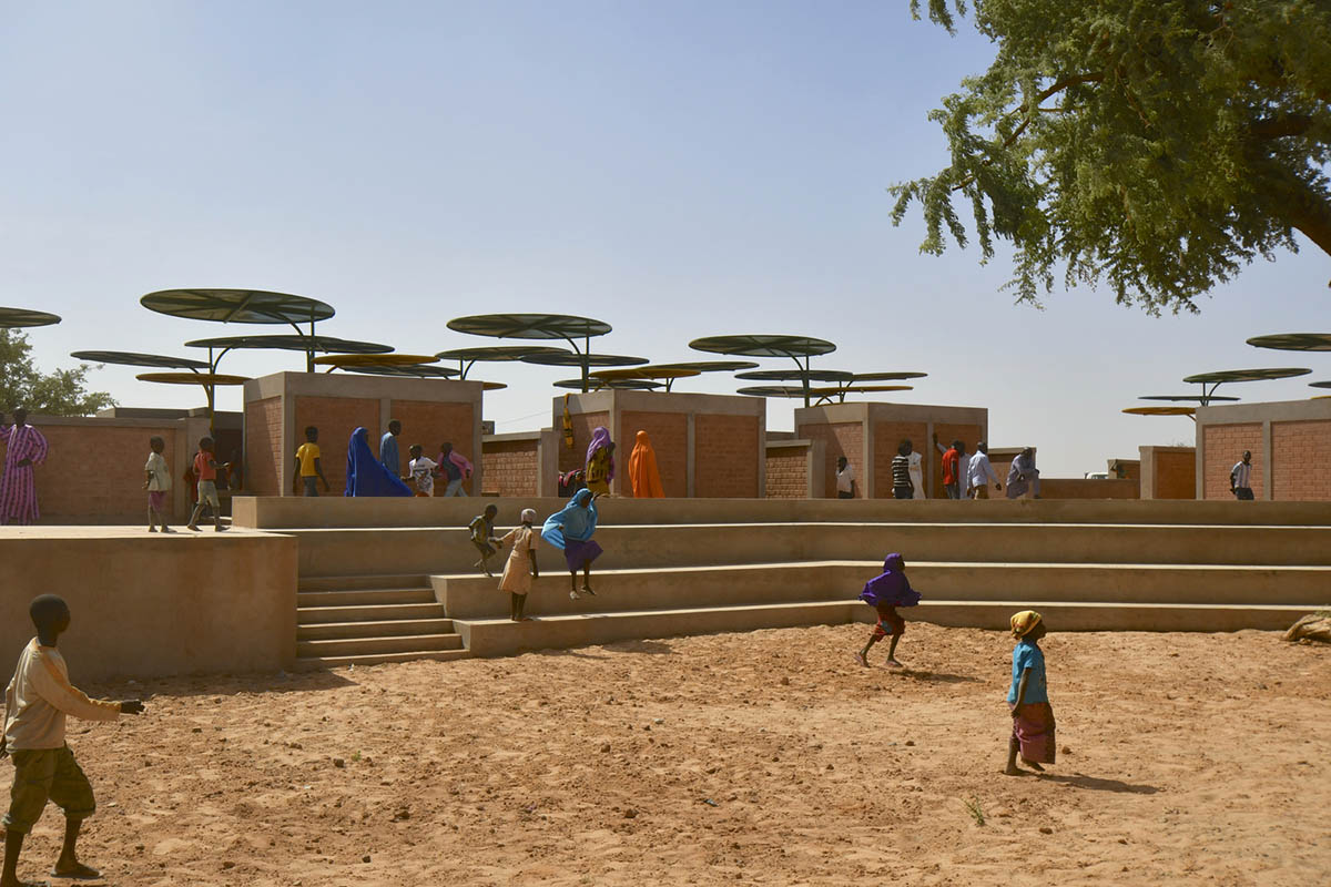 Colourful Metal Canopies Provide Thermal Comfort For Niger's Regional Market by Atelier Masōmī