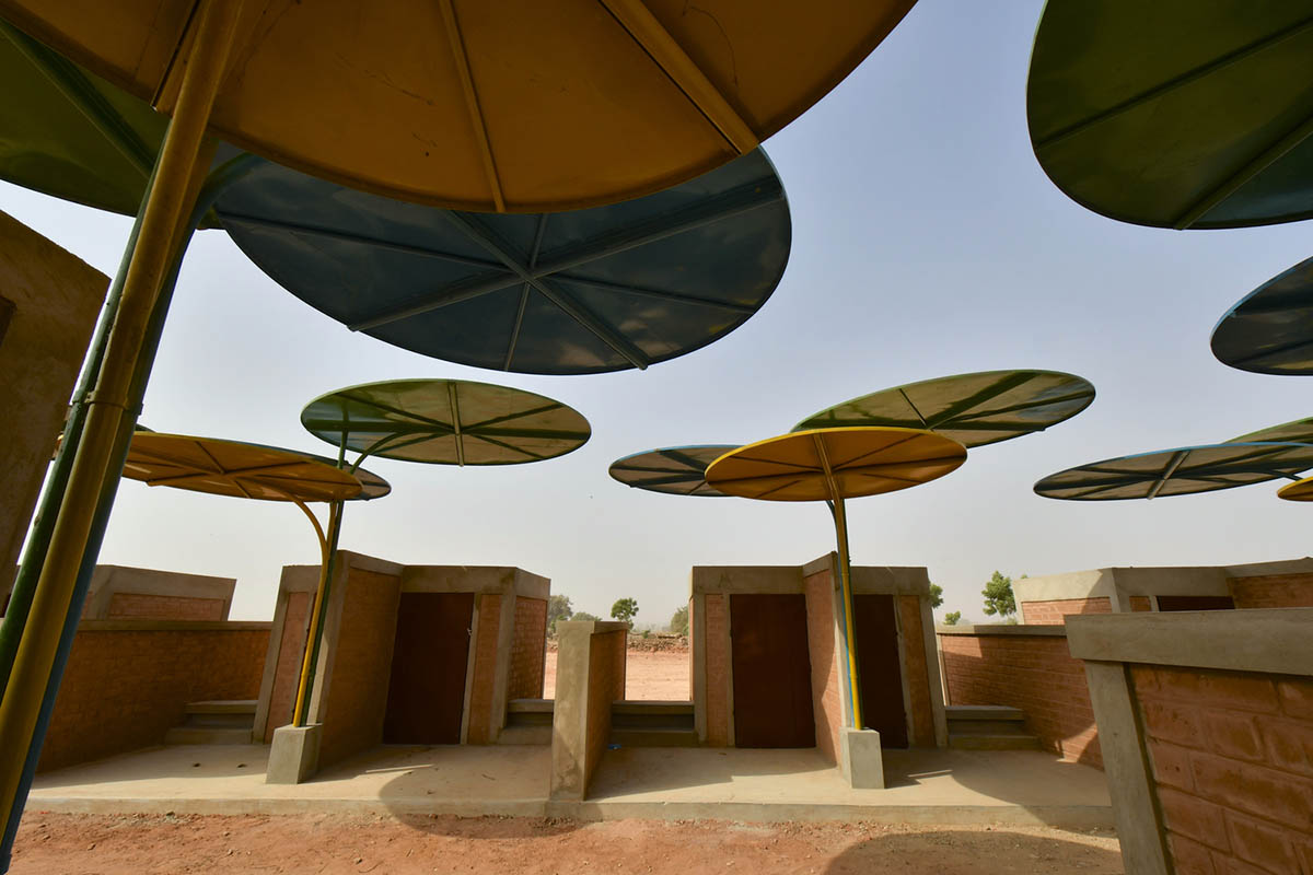 Colourful Metal Canopies Provide Thermal Comfort For Niger's Regional Market by Atelier Masōmī