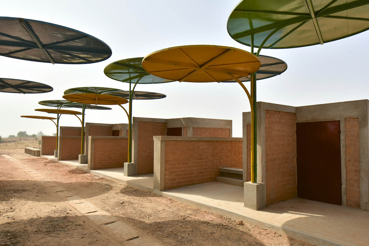 Colourful Metal Canopies Provide Thermal Comfort For Niger's Regional Market by Atelier Masōmī