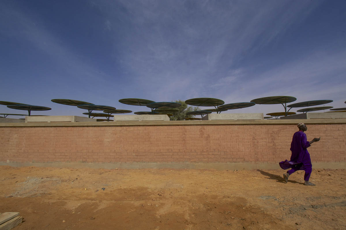 Colourful Metal Canopies Provide Thermal Comfort For Niger's Regional Market by Atelier Masōmī