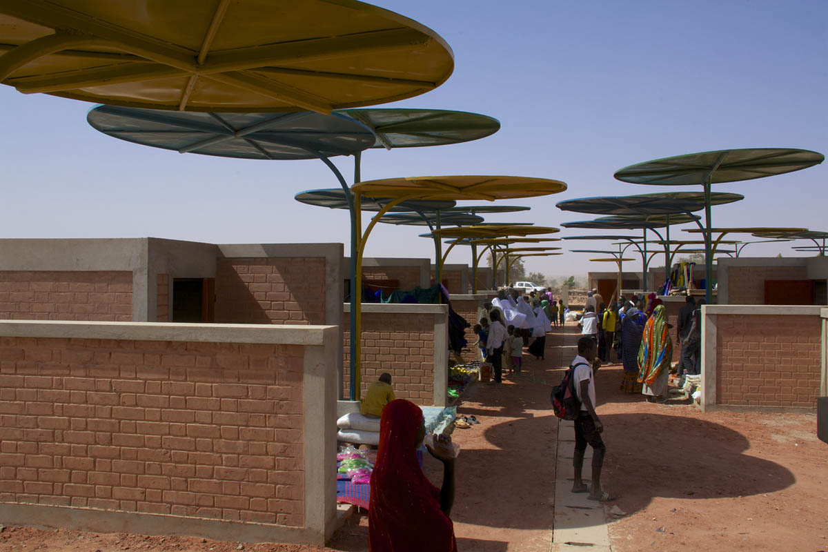 Colourful Metal Canopies Provide Thermal Comfort For Niger's Regional Market by Atelier Masōmī