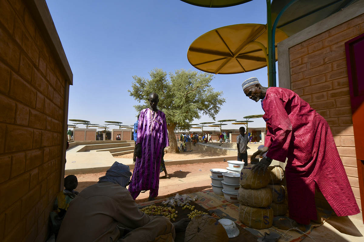 Colourful Metal Canopies Provide Thermal Comfort For Niger's Regional Market by Atelier Masōmī