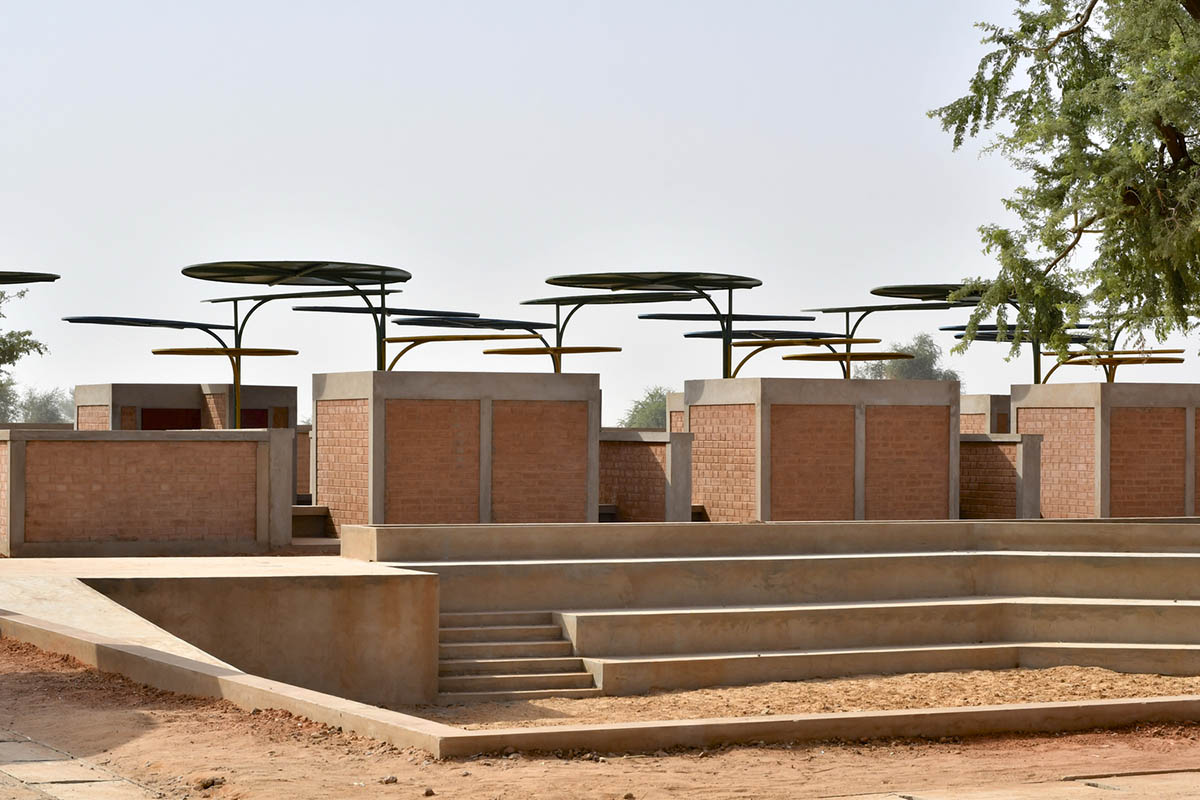 Colourful Metal Canopies Provide Thermal Comfort For Niger's Regional Market by Atelier Masōmī