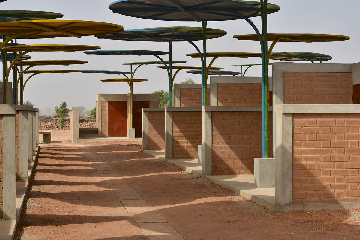 Colourful Metal Canopies Provide Thermal Comfort For Niger's Regional Market by Atelier Masōmī