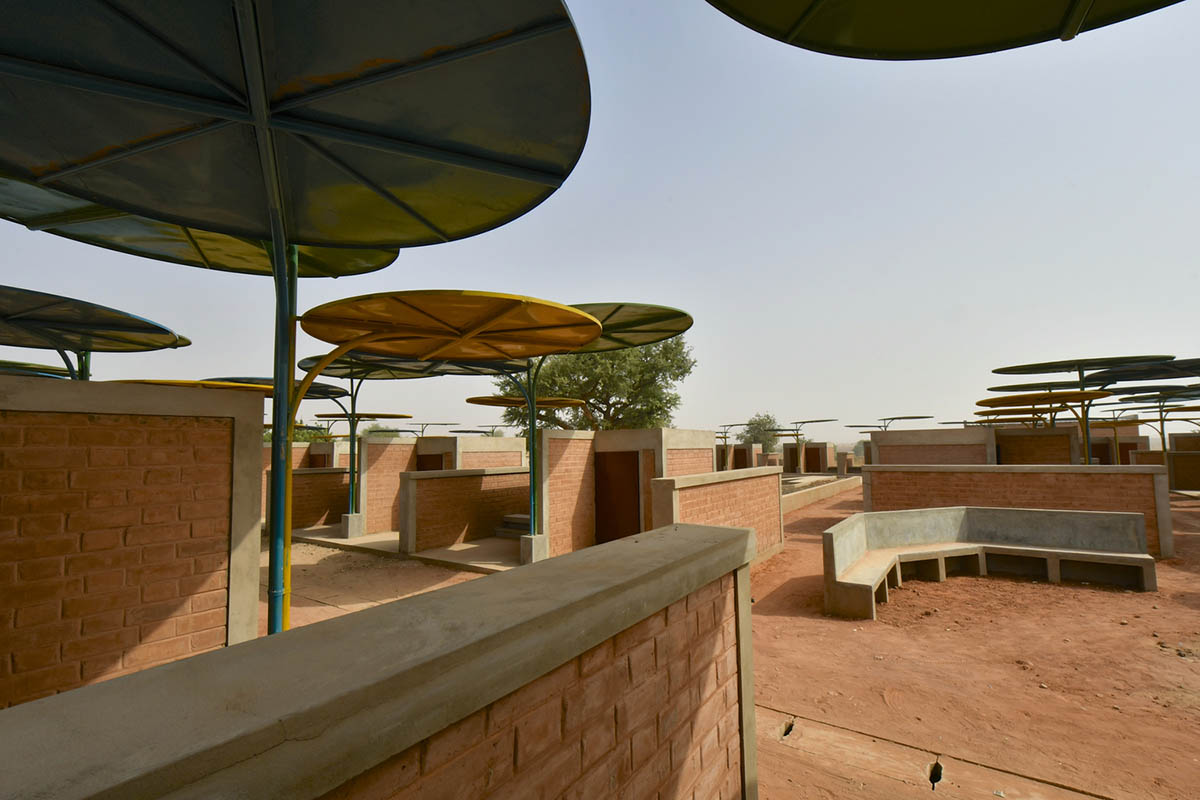 Colourful Metal Canopies Provide Thermal Comfort For Niger's Regional Market by Atelier Masōmī