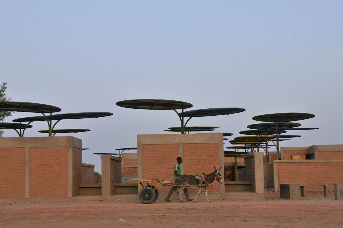Colourful Metal Canopies Provide Thermal Comfort For Niger's Regional Market by Atelier Masōmī