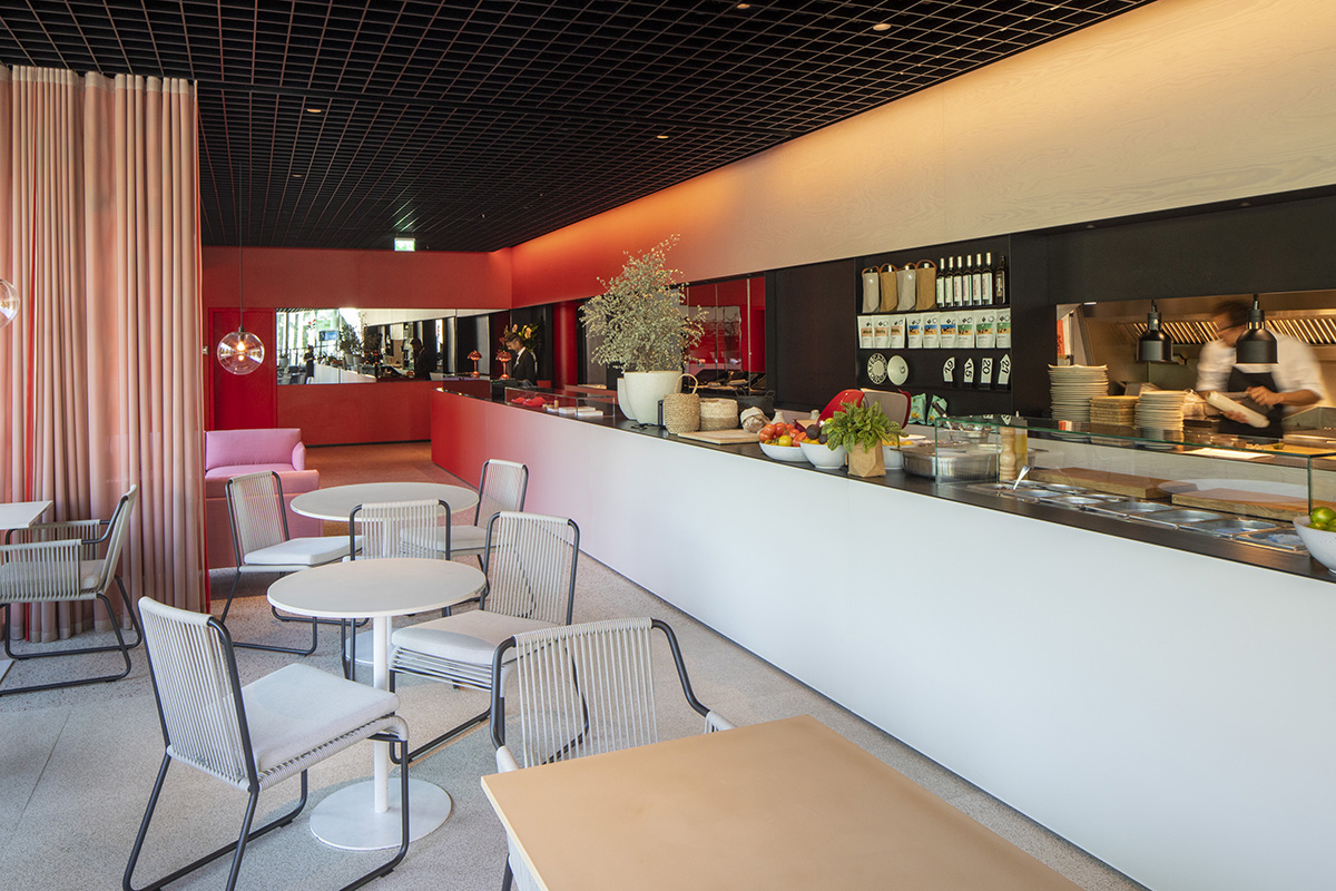 MVRDV adds striking color gradient to Café Camaleon in Berlin that unites three functions