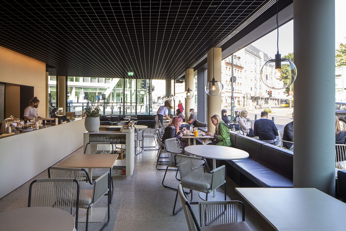 MVRDV adds striking color gradient to Café Camaleon in Berlin that unites three functions