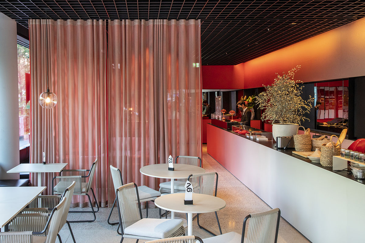 MVRDV adds striking color gradient to Café Camaleon in Berlin that unites three functions