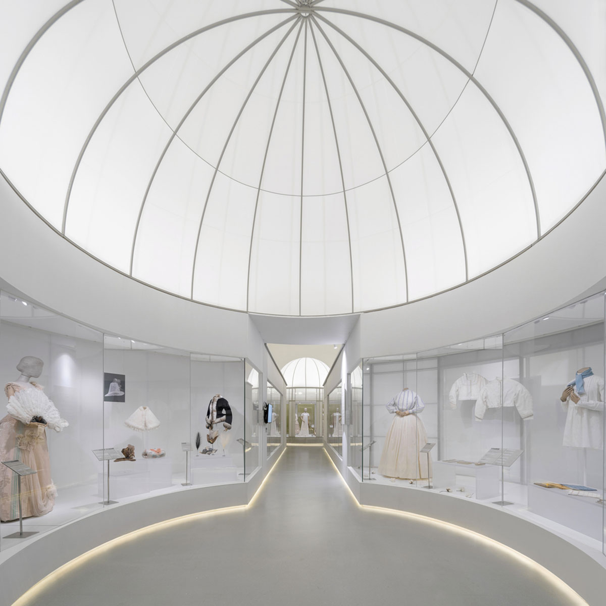 Studio 10 designs exhibition space with white tubular structures and black translucent ramps in China