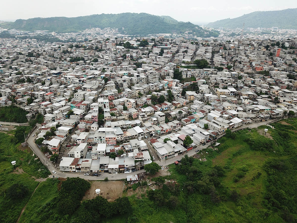 Permeable community house is inserted into Ecuador's existing fabric to serve micro communities 
