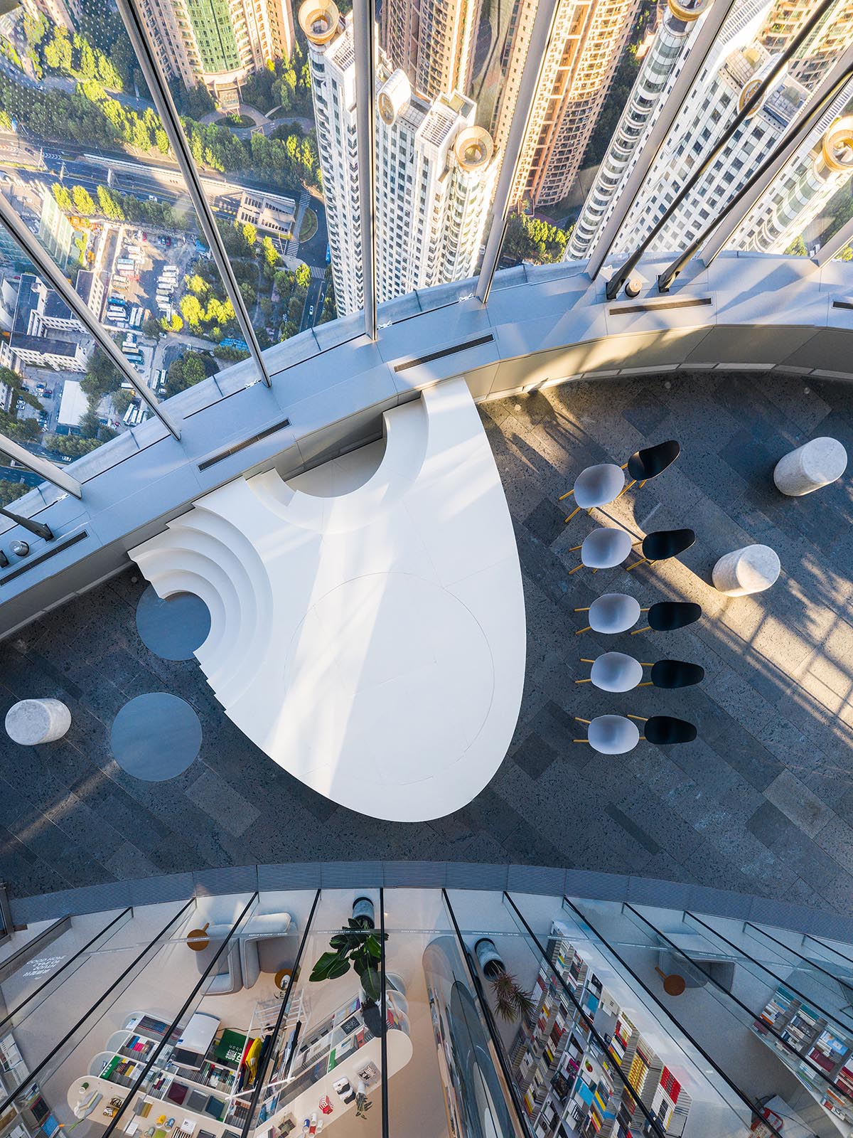 Wutopia Lab creates continuous space for stack of books inside of Shanghai's tallest building