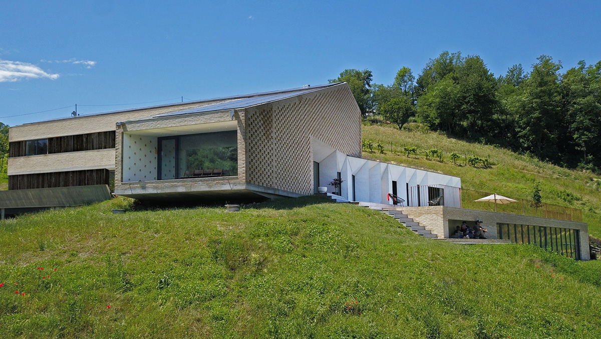 F:L Architetti creates layers of uses in this rural villa and farmhouse on the hills of Italy