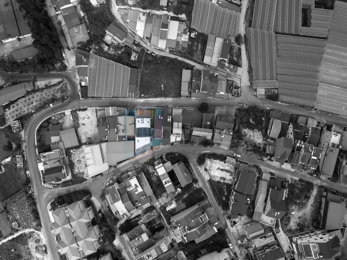 Le House wraps this small hotel with porous steel facade made of irregular patterns in Vietnam