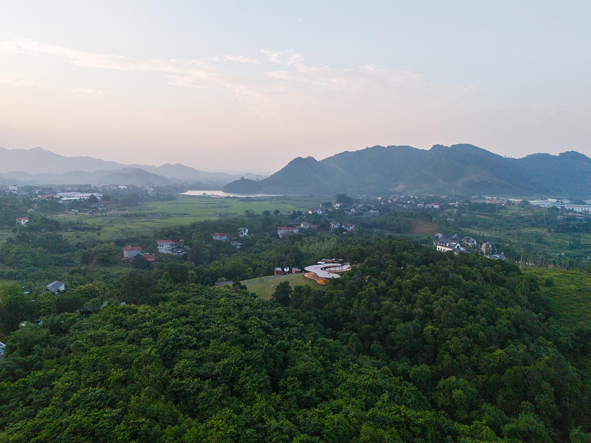 Idee architects creates sinuous and reflective canopy for Quin Pavilion on Hanoi hills