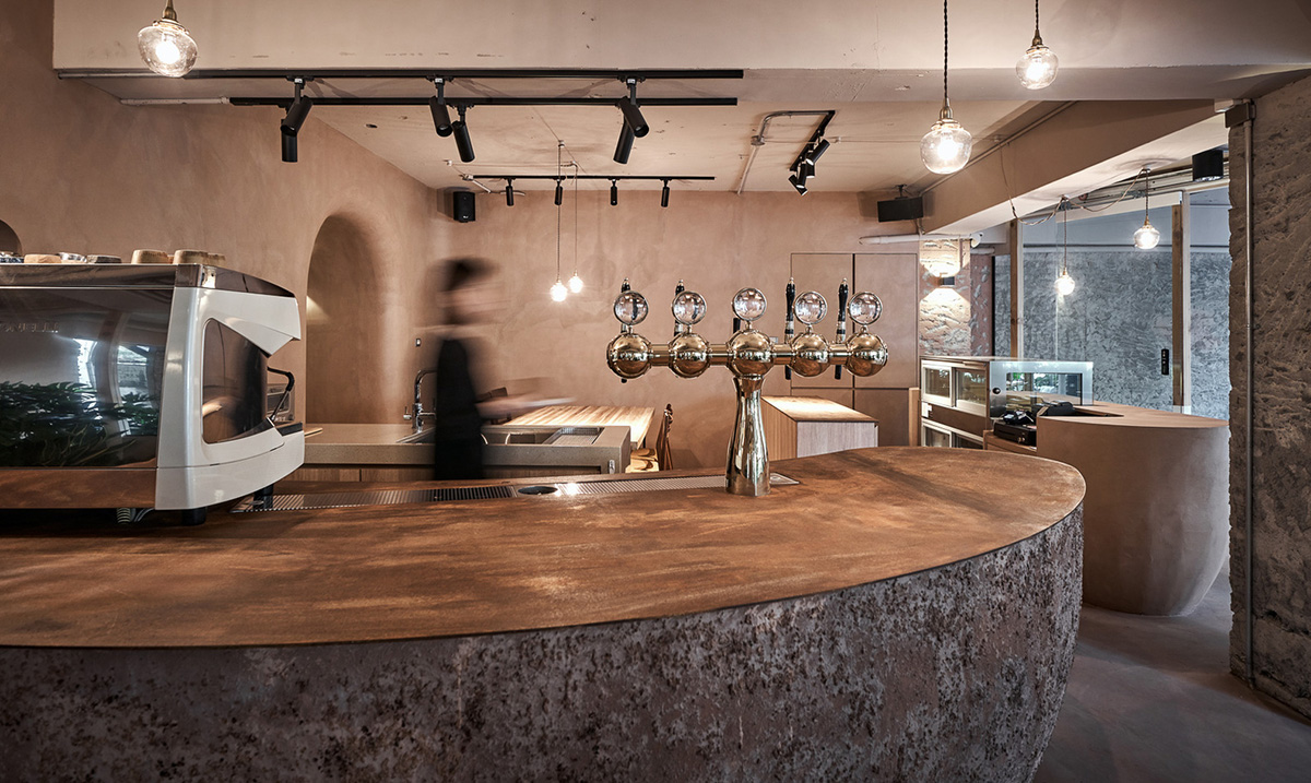 Soar Design Studio adds greenery and smooth surfaces to chocolate store offering garden-like space