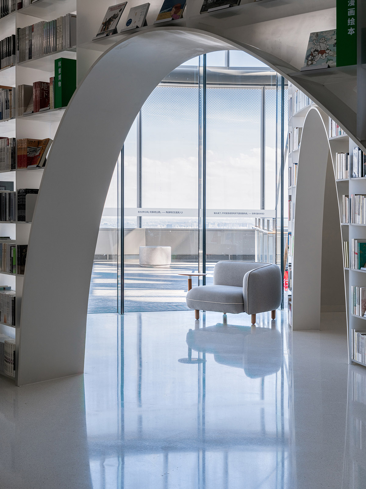 Wutopia Lab creates continuous space for stack of books inside of Shanghai's tallest building