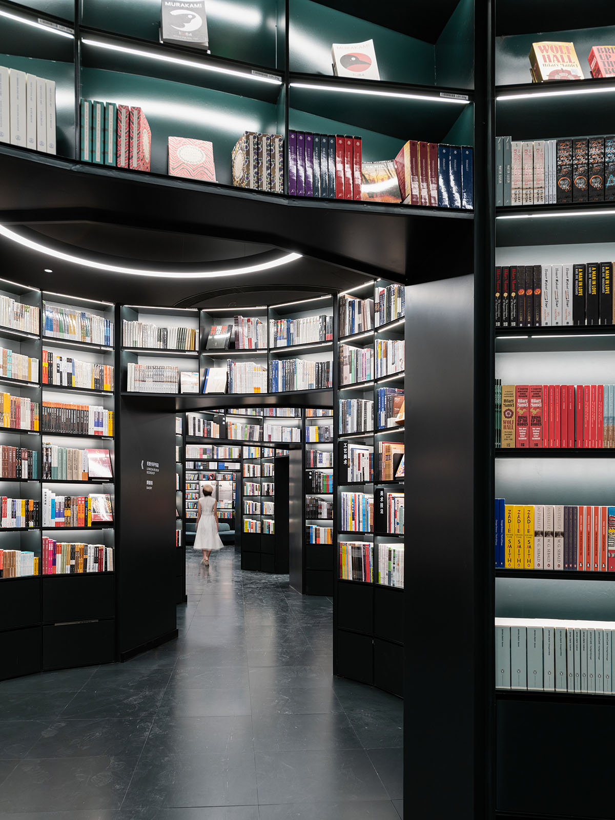 Wutopia Lab creates continuous space for stack of books inside of Shanghai's tallest building