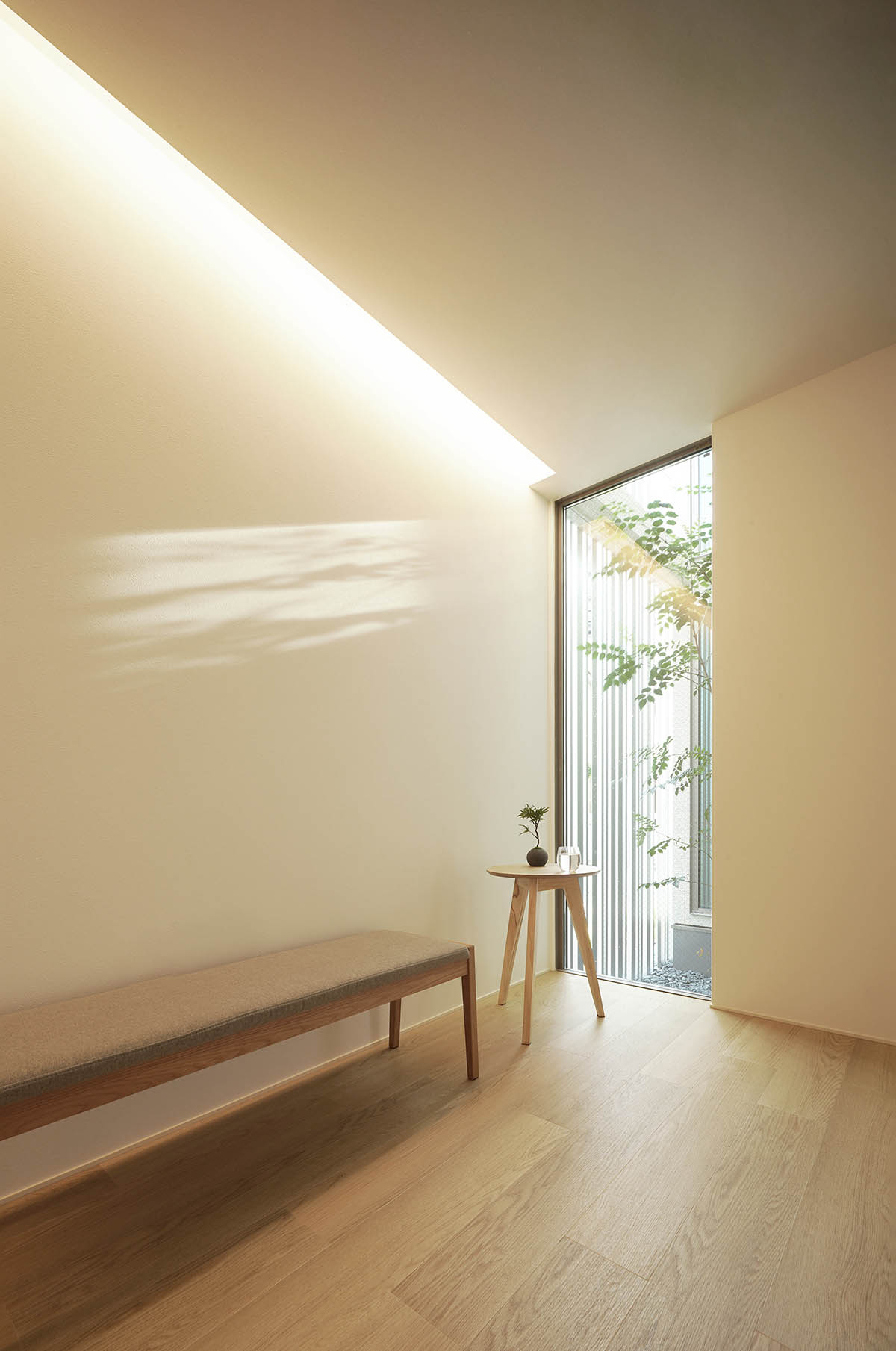 Jun Murata built small guesthouse with cut-out skylight in Japan