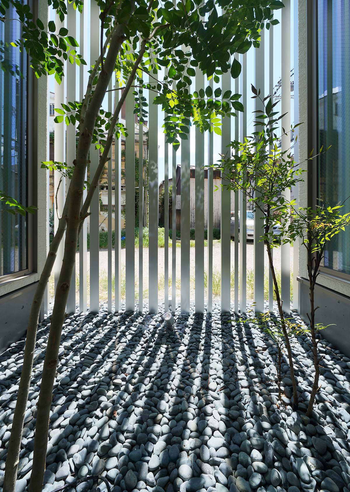 Jun Murata built small guesthouse with cut-out skylight in Japan