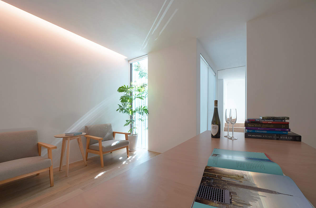 Jun Murata built small guesthouse with cut-out skylight in Japan