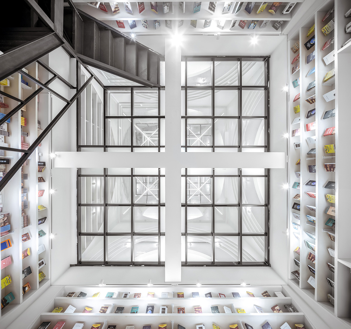 The First Zhongshu Bookstore in Xi'an, China by Wutopia Lab Performs a White Divine Comedy