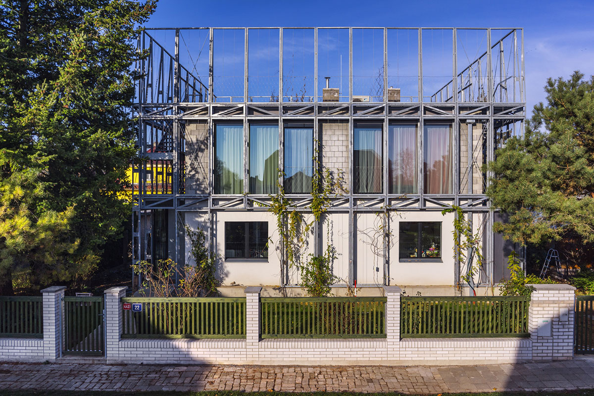 ŠÉPKA Architects wraps old residence with steel lattice featuring climbing plants as facade element
