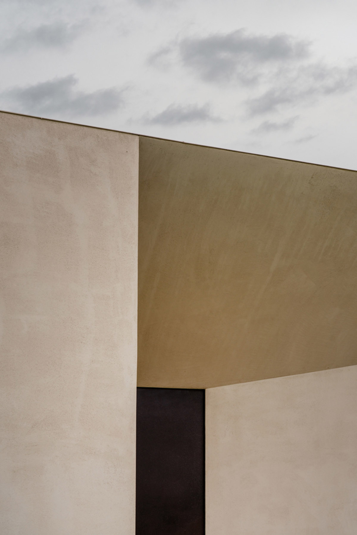 Holiday villa by Westway Architects comprises three distinct volumes made of Note stone in Italy 