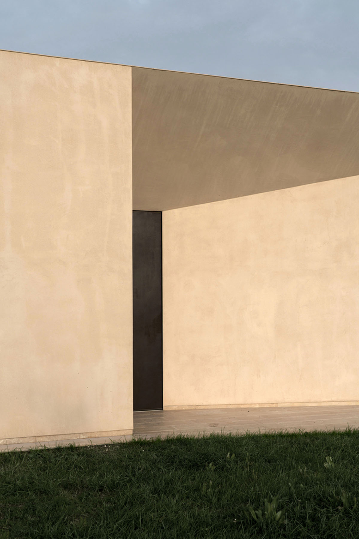 Holiday villa by Westway Architects comprises three distinct volumes made of Note stone in Italy 