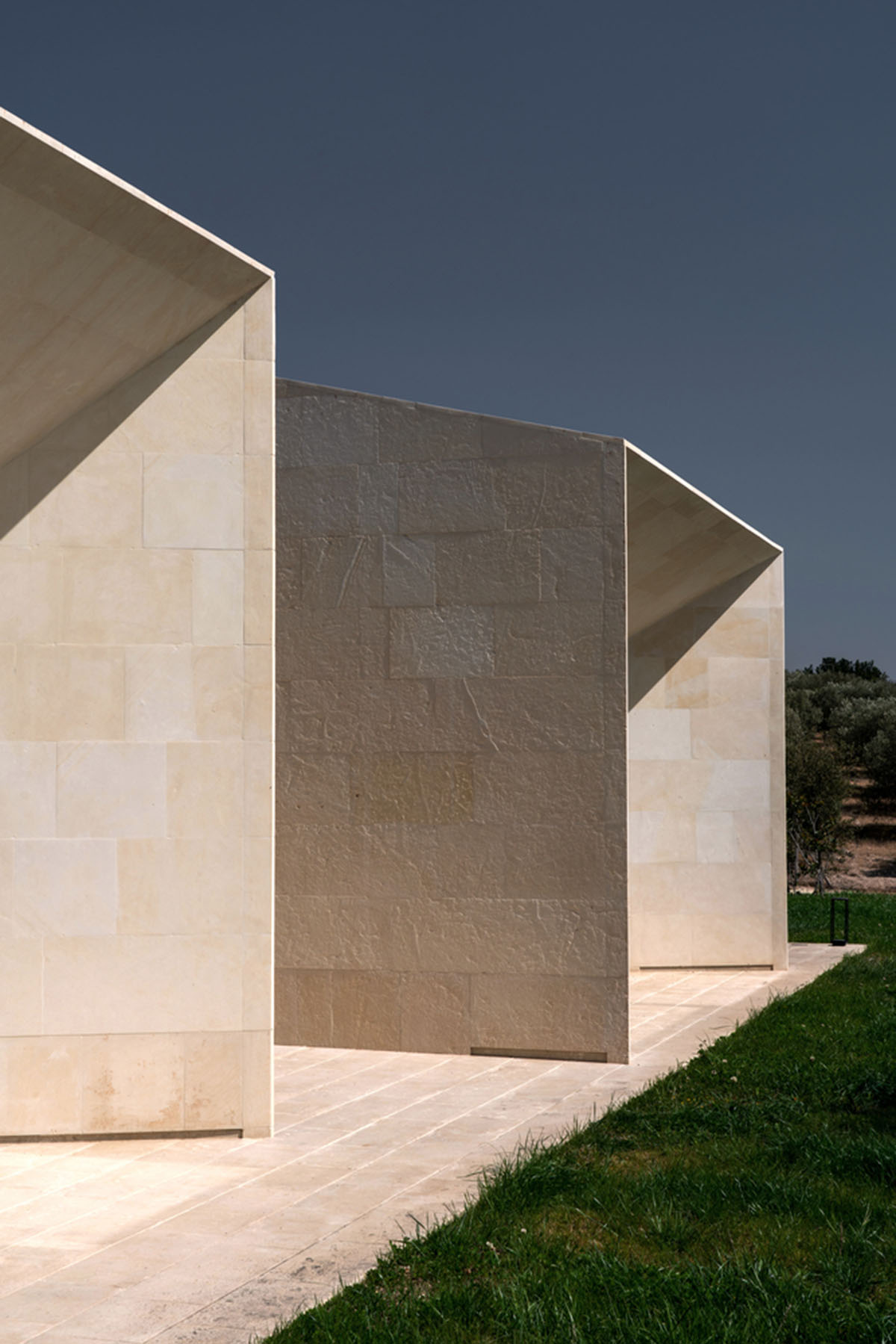 Holiday villa by Westway Architects comprises three distinct volumes made of Note stone in Italy 