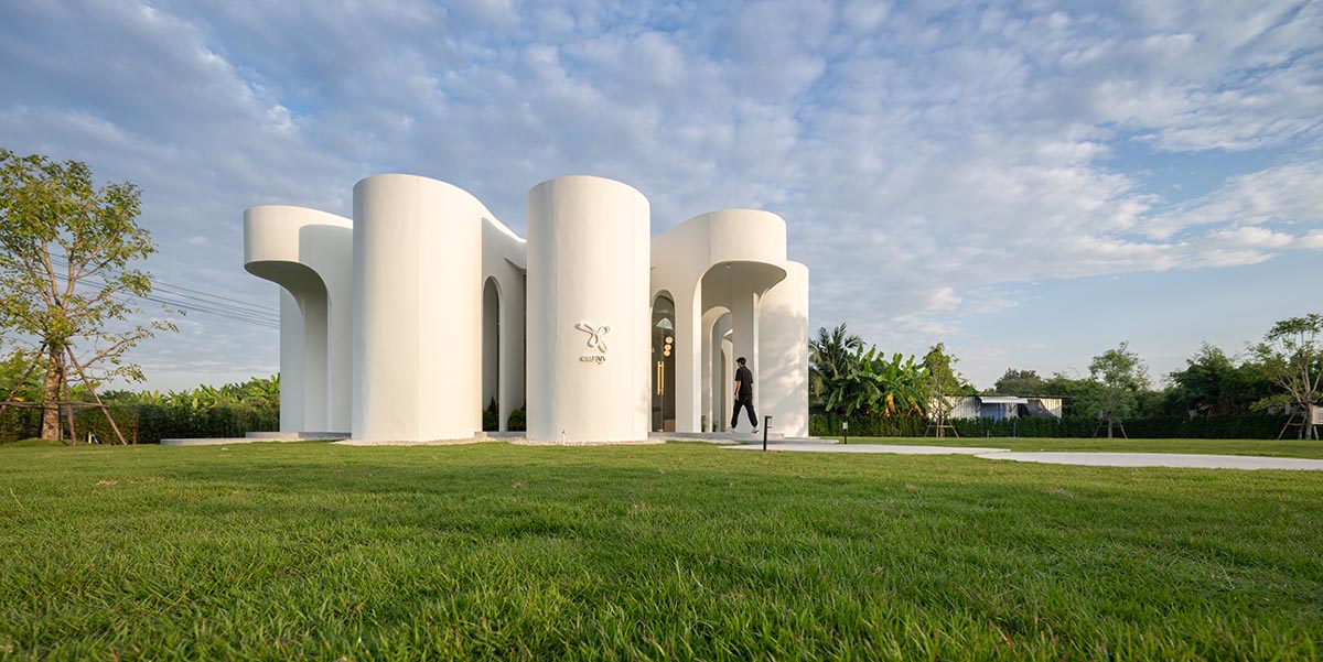 A flower-inspired cafe blooms in a fluid design within Bangkok's industrial landscape