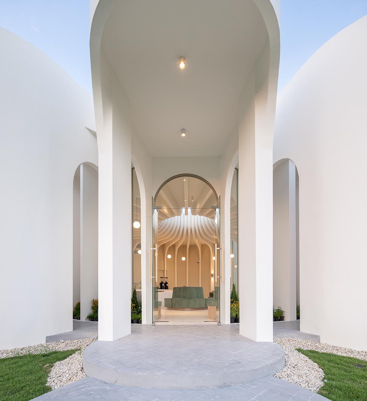 A flower-inspired cafe blooms in a fluid design within Bangkok's industrial landscape