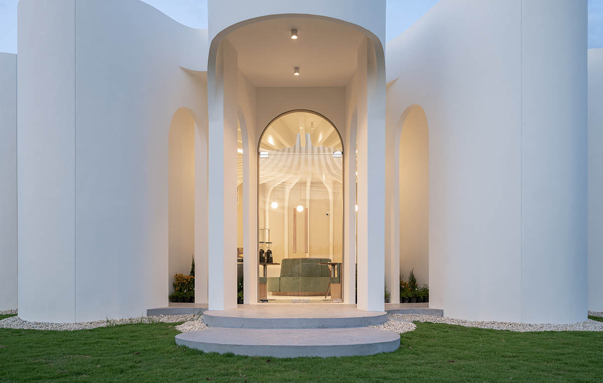 A flower-inspired cafe blooms in a fluid design within Bangkok's industrial landscape