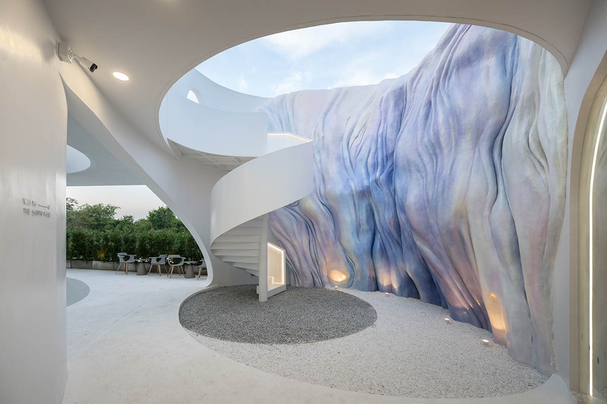Unknown Surface Studio creates sinuous Uncloud Caffee in Thailand