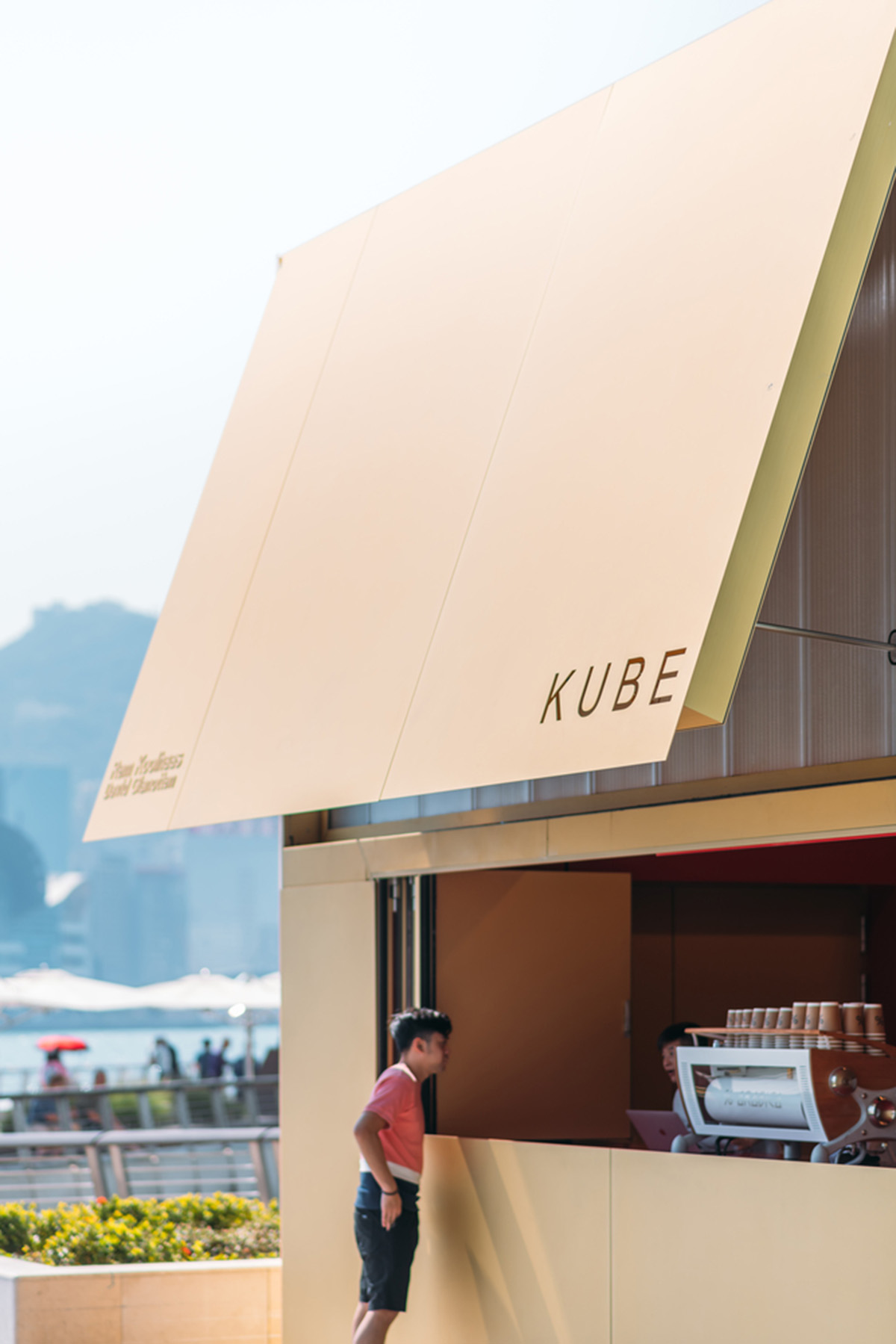 OMA reveals its golden KUBE as multi-functional installation on Hong Kong's waterfront
