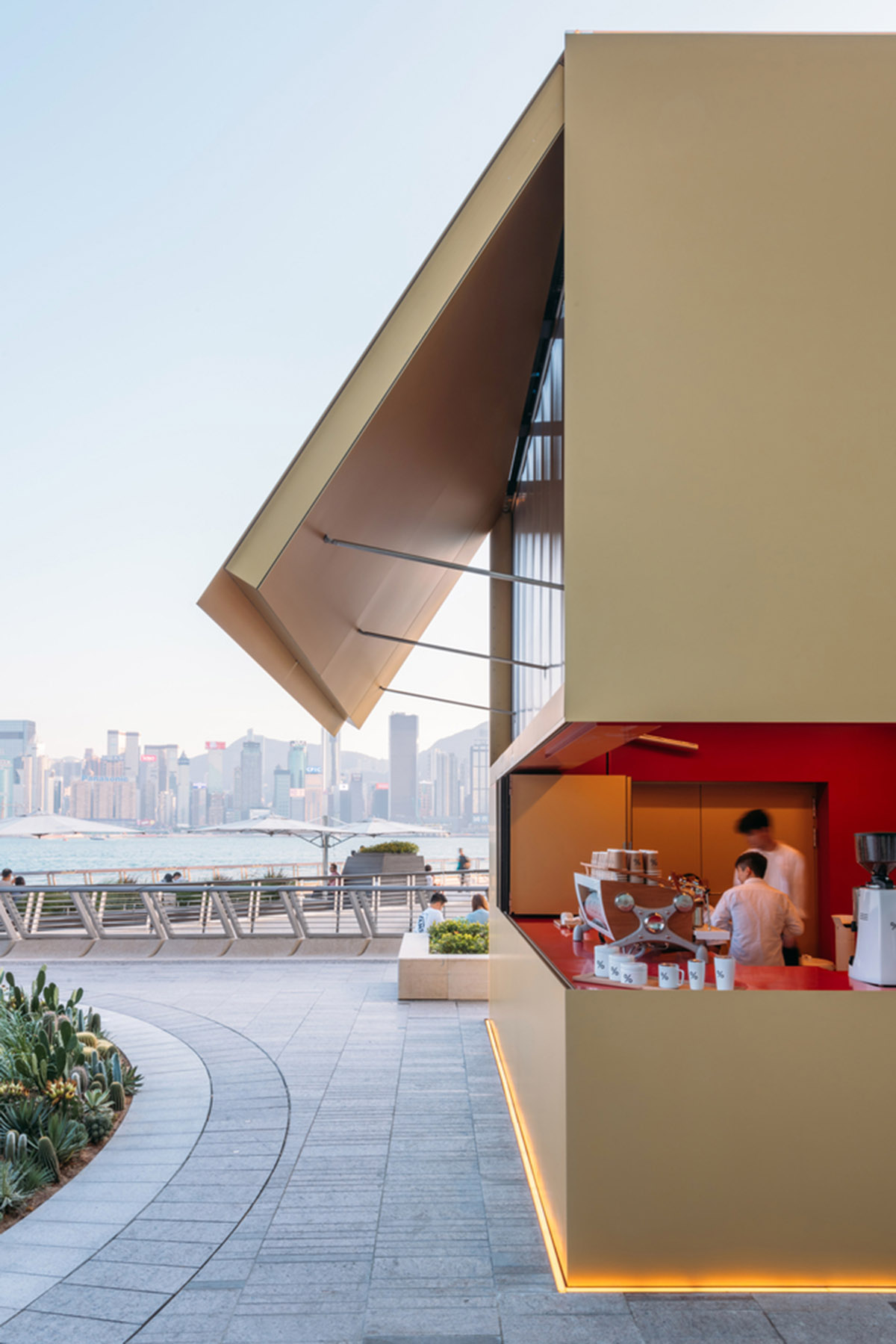 OMA reveals its golden KUBE as multi-functional installation on Hong Kong's waterfront