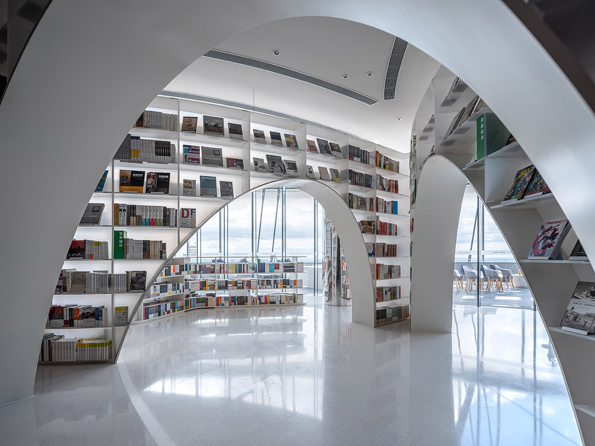 Wutopia Lab creates continuous space for stack of books inside of Shanghai's tallest building