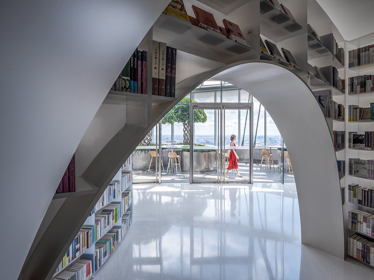 Wutopia Lab creates continuous space for stack of books inside of Shanghai's tallest building