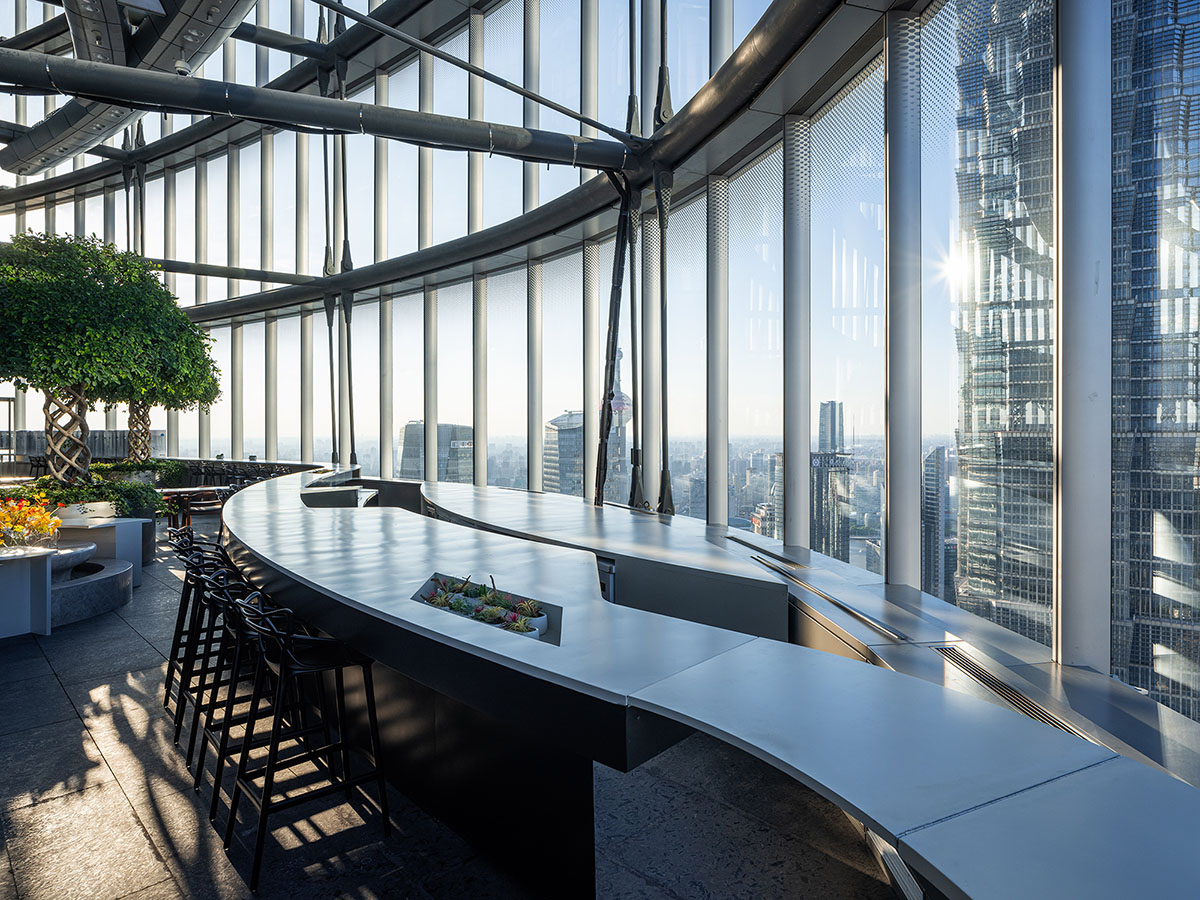 Wutopia Lab creates continuous space for stack of books inside of Shanghai's tallest building