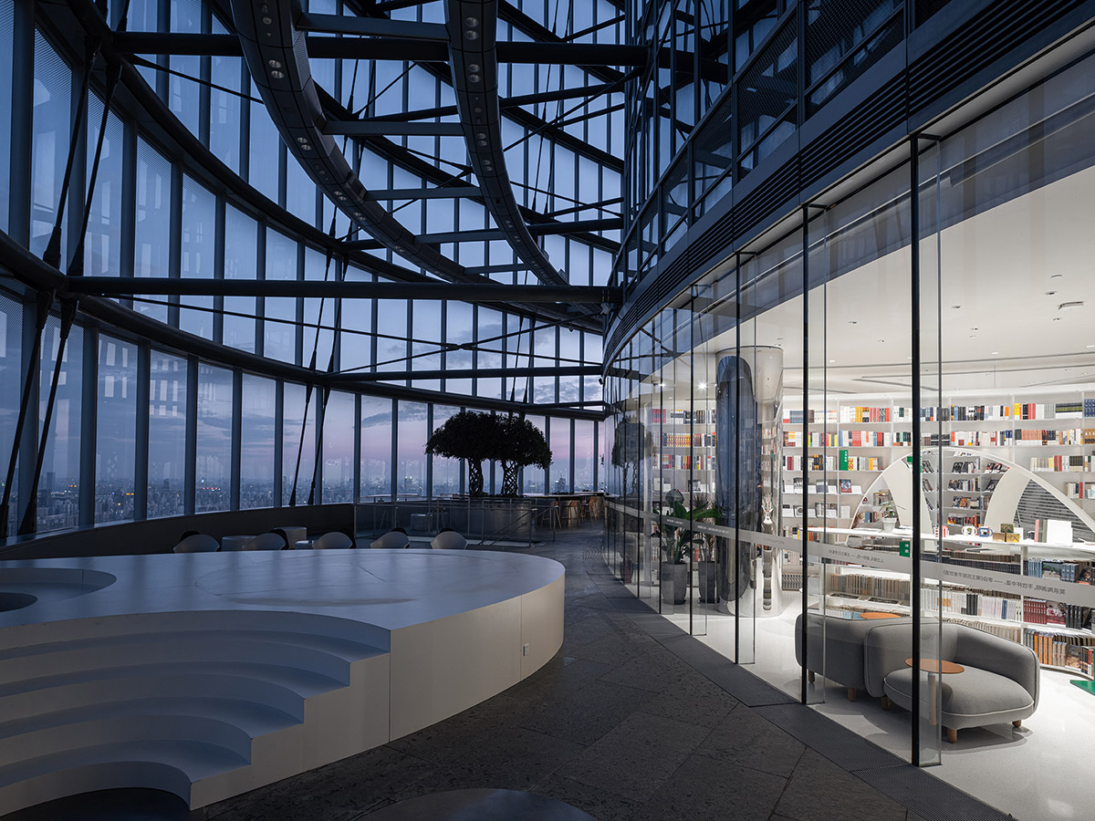 Wutopia Lab creates continuous space for stack of books inside of Shanghai's tallest building