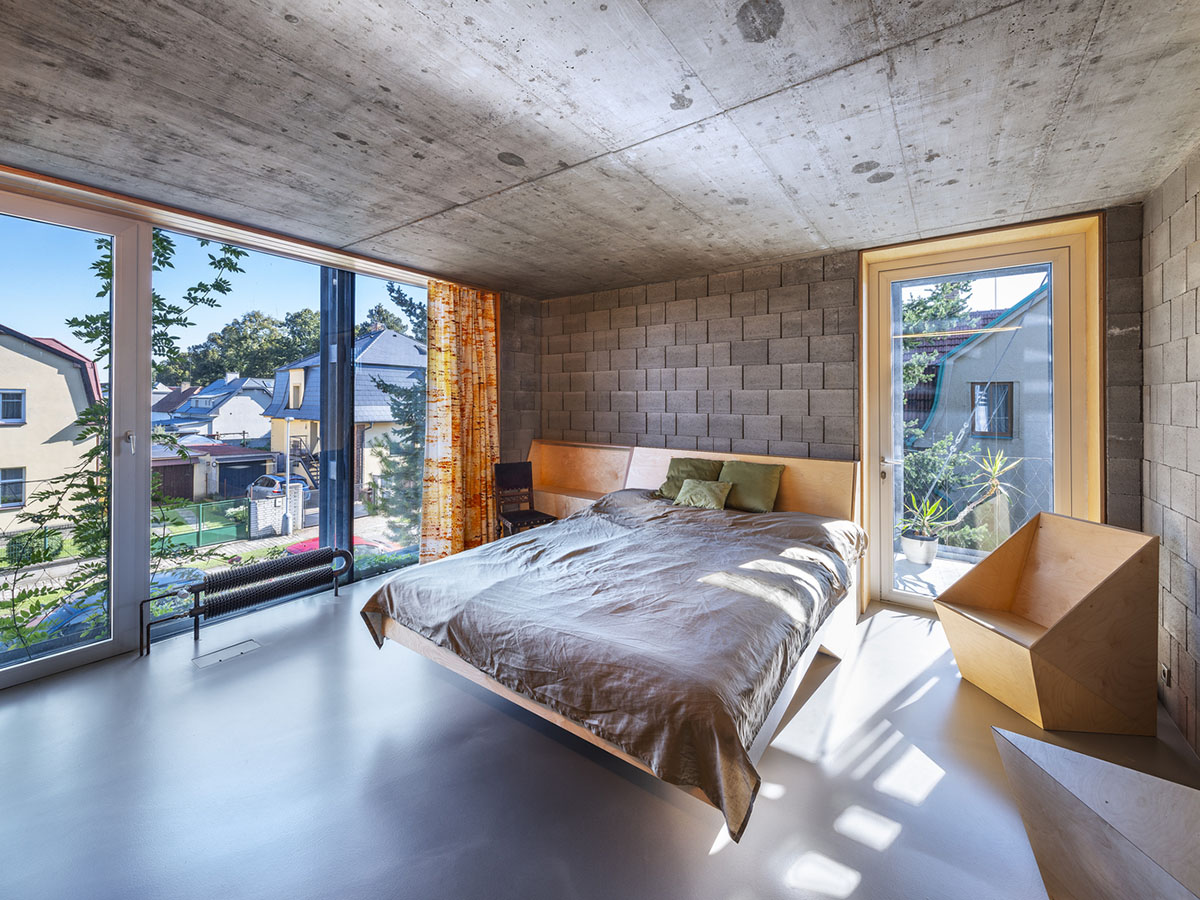 ŠÉPKA Architects wraps old residence with steel lattice featuring climbing plants as facade element