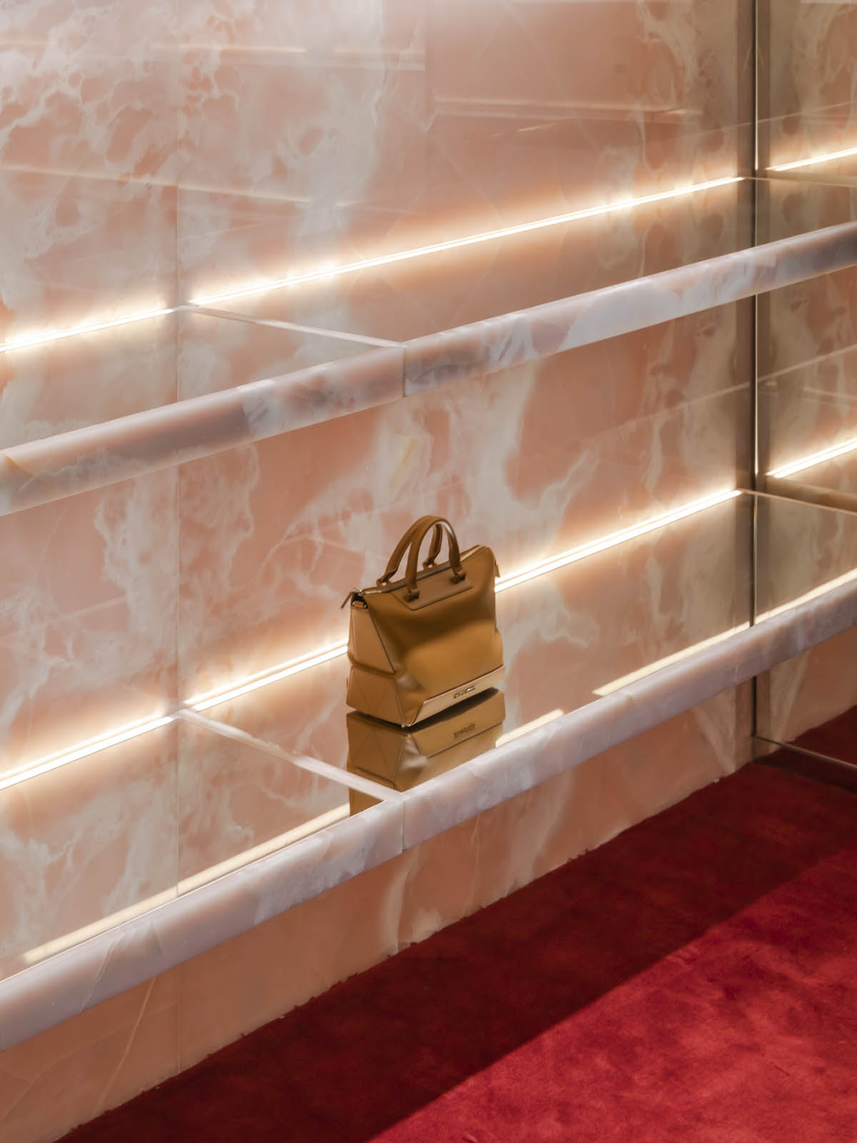 Giant sienna-colored meteor rock is suspended from the ceiling of flagship store in Kuala Lumpur