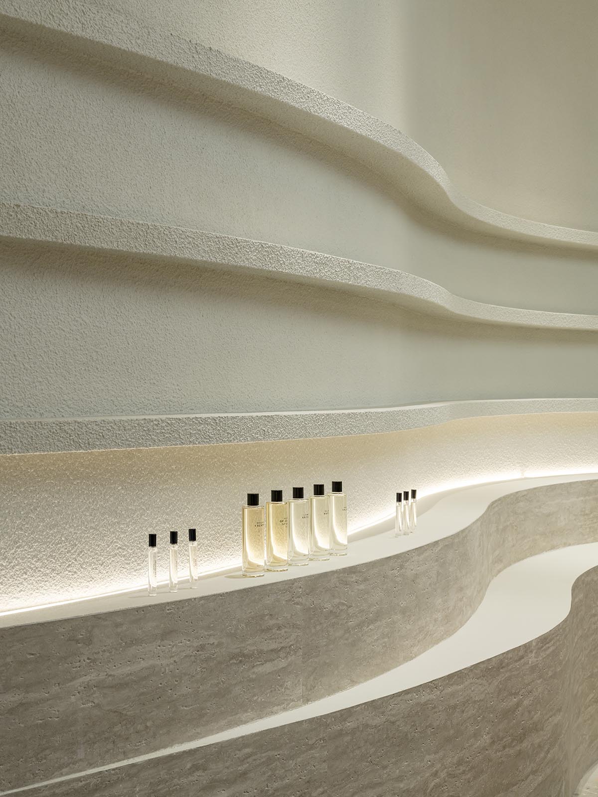 Spacemen adds circular stainless-steel rainbow cabin to a beauty store in Kuala Lumpur