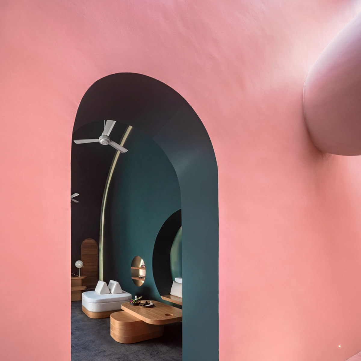 onion combines white concave and convex walls with colorful surfaces for beach resort in Thailand